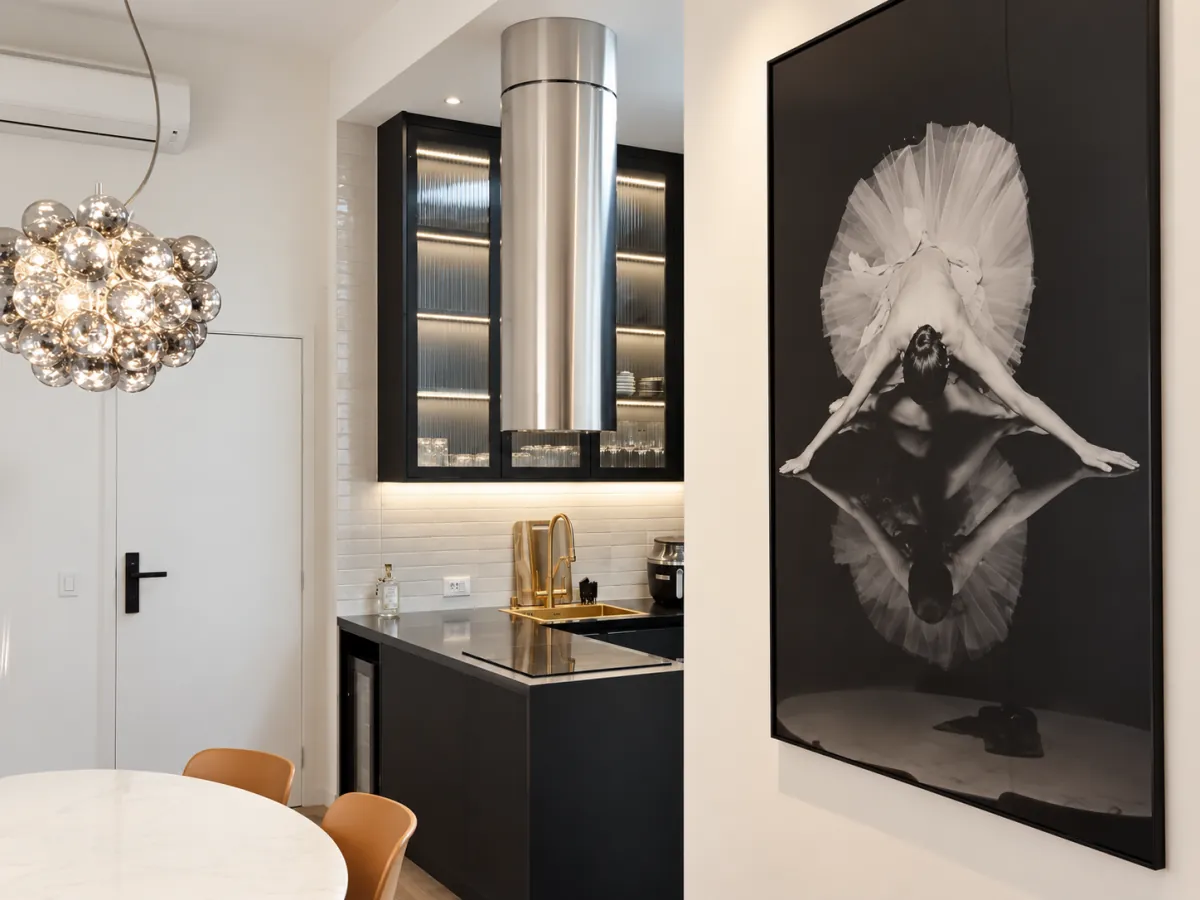 Luxury long stay Sao Paulo, apartment entrance with open kitchen and framed artwork